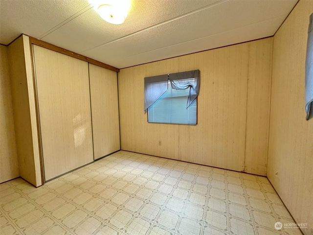 empty room with wooden walls