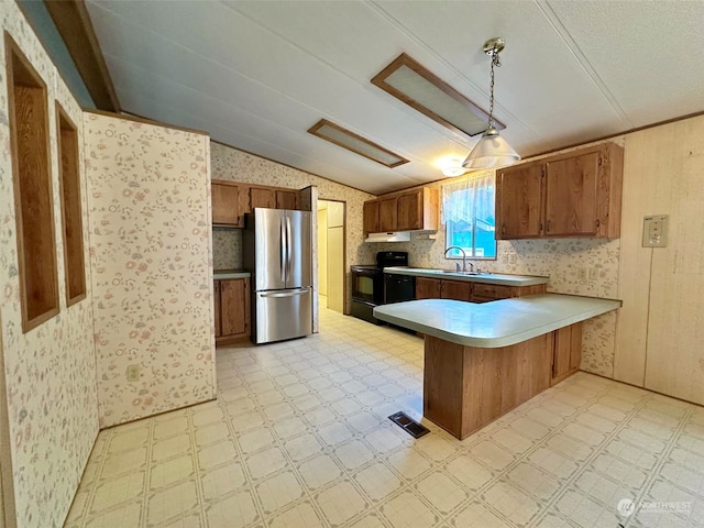 kitchen with kitchen peninsula, sink, stainless steel refrigerator, hanging light fixtures, and black range with electric cooktop