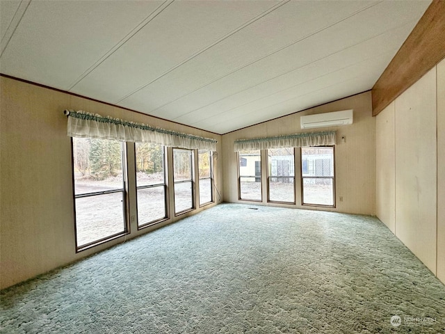 interior space featuring plenty of natural light, carpet, and a wall unit AC