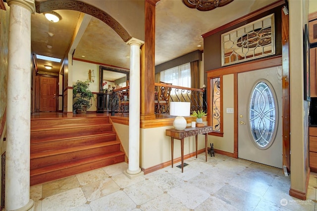 entrance foyer featuring ornate columns