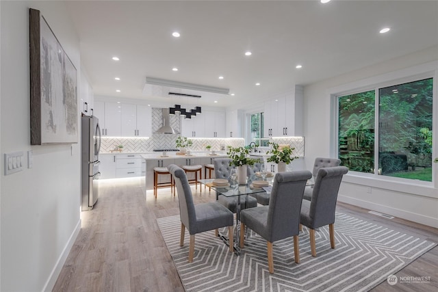 dining area with light wood-type flooring