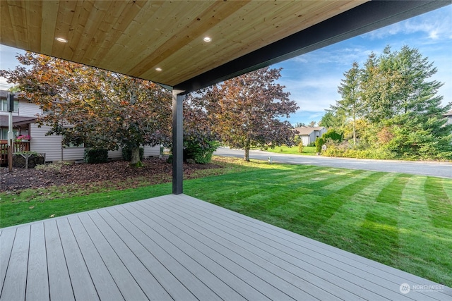 wooden terrace with a yard