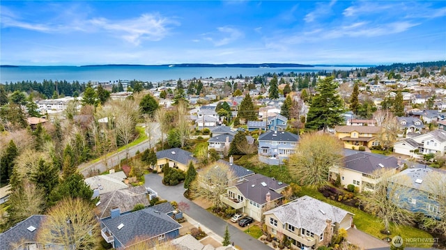 bird's eye view featuring a water view and a residential view