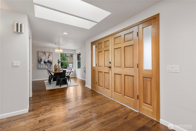 entryway featuring recessed lighting, baseboards, and wood finished floors