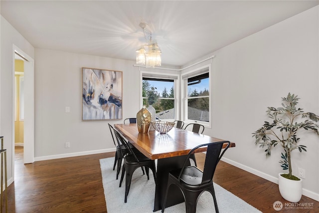 dining area with a notable chandelier, baseboards, and dark wood-style flooring