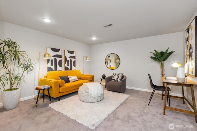 carpeted living area with baseboards, visible vents, and recessed lighting