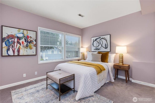 carpeted bedroom featuring visible vents and baseboards