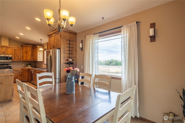 tiled dining area with lofted ceiling, sink, and a chandelier