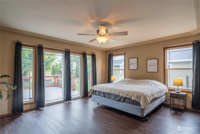 bedroom featuring ceiling fan, dark hardwood / wood-style flooring, access to outside, and ornamental molding