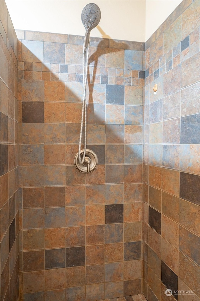 bathroom with a tile shower