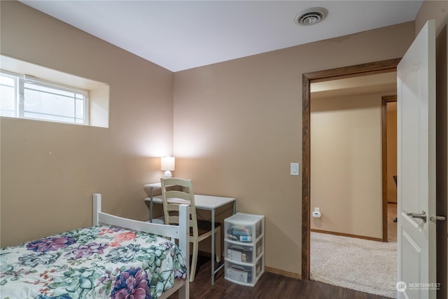 bedroom featuring dark wood-type flooring