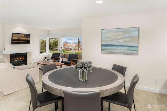 view of carpeted dining area