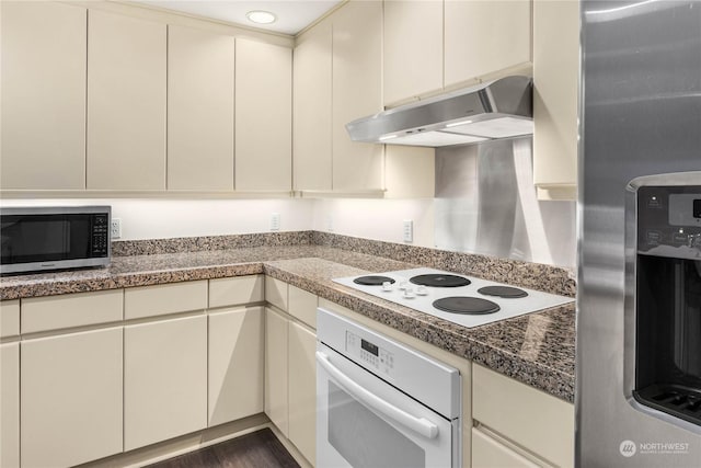 kitchen with stainless steel appliances and cream cabinets