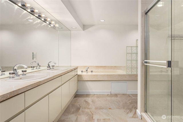 bathroom featuring vanity and separate shower and tub