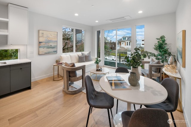 dining room with light hardwood / wood-style floors