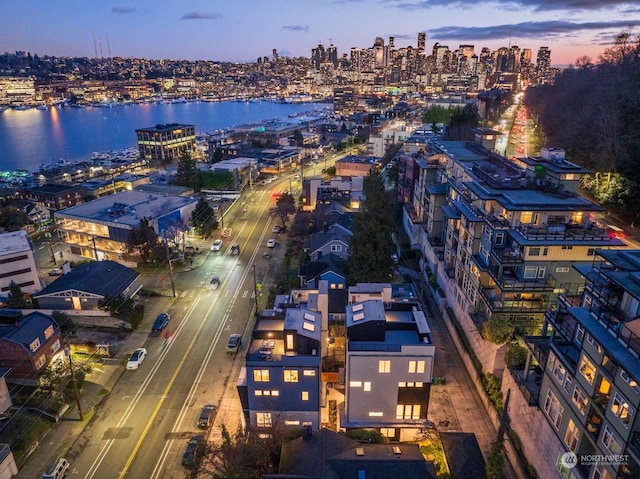 aerial view at dusk with a water view