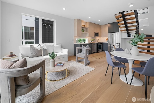 2011A Dexter Ave N, Seattle, WA 98109 - living room featuring light wood-type flooring, stairs, and recessed lighting