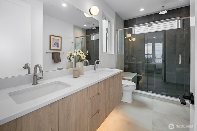 2011A Dexter Ave N, Seattle, WA 98109 - bathroom with double vanity, a shower stall, recessed lighting, and tile patterned floors