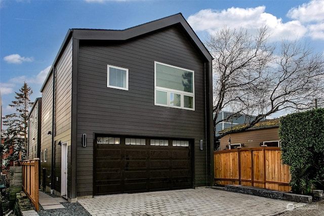 view of property exterior featuring a garage