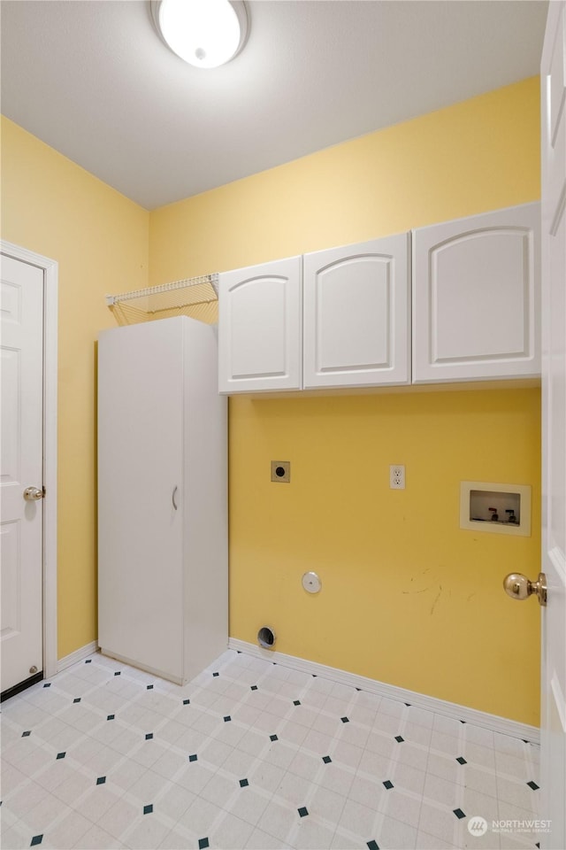 laundry room with hookup for a washing machine, cabinets, and electric dryer hookup