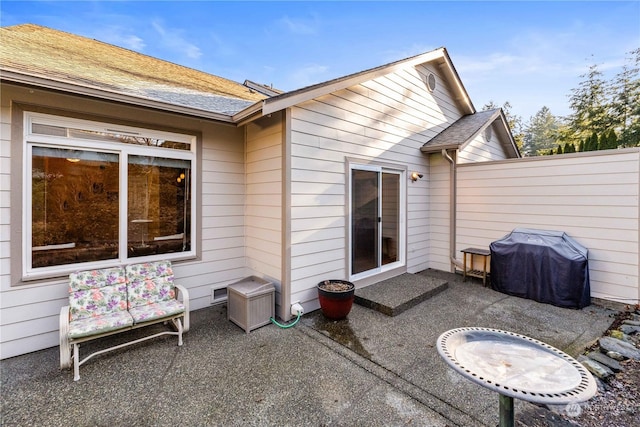 back of property with a patio