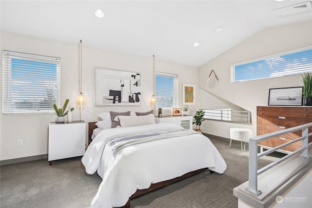 carpeted bedroom with lofted ceiling