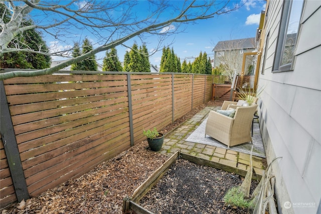 view of yard with an outdoor living space and a patio area