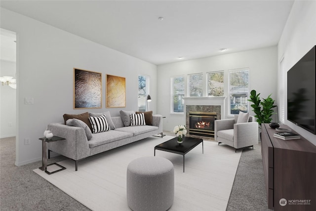 carpeted living room featuring a wealth of natural light and a fireplace