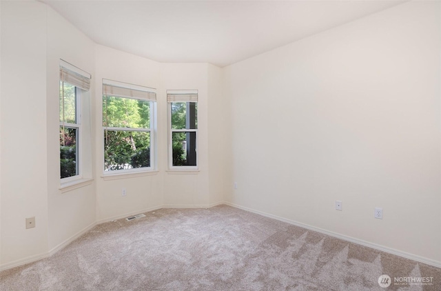 22635 SE 44th Pl Unit 1631, Issaquah, WA 98029 - carpeted spare room featuring plenty of natural light and baseboards