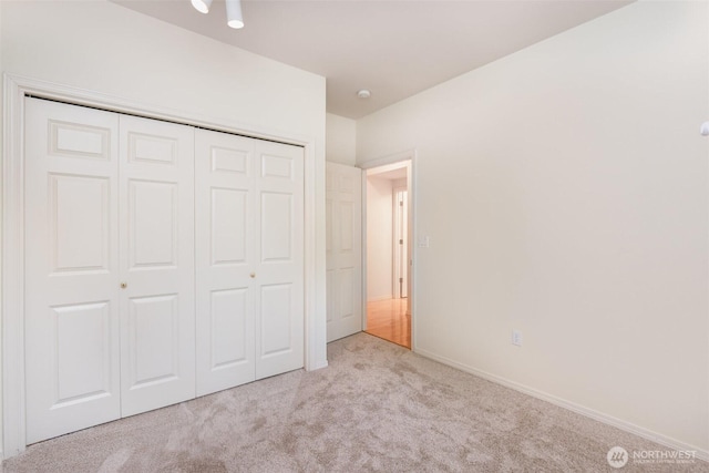 22635 SE 44th Pl Unit 1631, Issaquah, WA 98029 - unfurnished bedroom featuring carpet, a closet, and baseboards