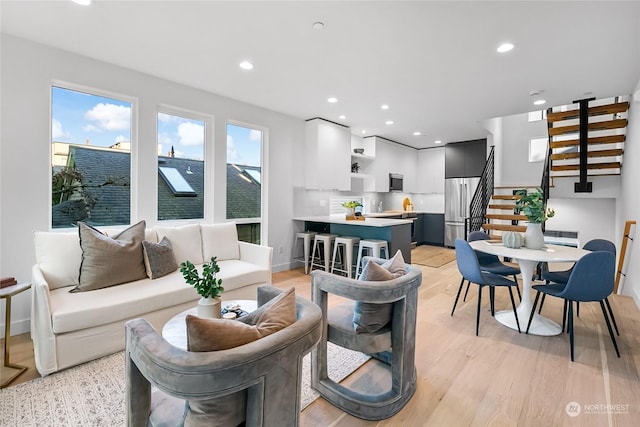 living room with light hardwood / wood-style floors