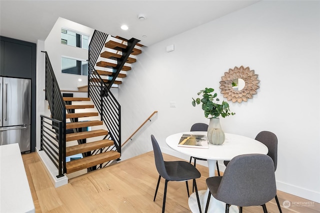 dining space featuring wood-type flooring