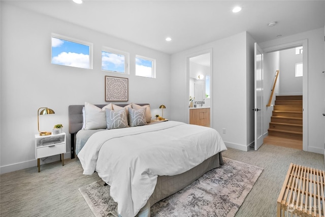 carpeted bedroom with ensuite bathroom