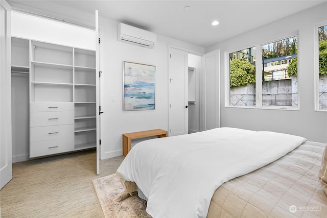 bedroom featuring an AC wall unit