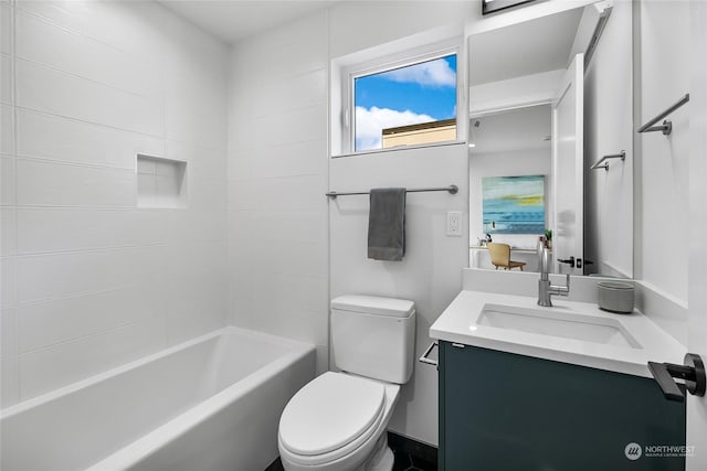 full bathroom featuring vanity, bathtub / shower combination, and toilet