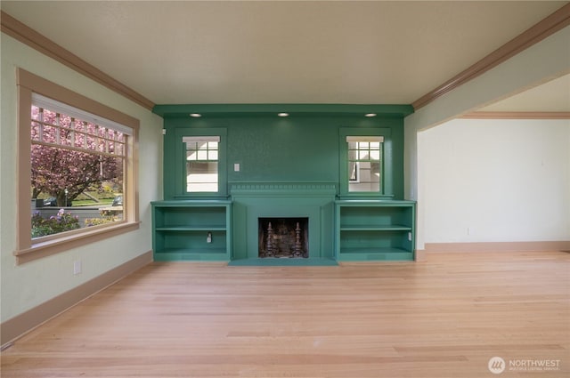 811 N I St, Tacoma, WA 98403 - unfurnished living room with a fireplace with flush hearth, baseboards, crown molding, and wood finished floors
