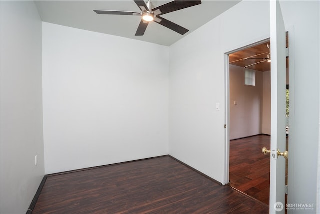811 N I St, Tacoma, WA 98403 - spare room featuring dark wood finished floors, baseboards, and a ceiling fan