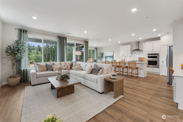 living room with light hardwood / wood-style floors