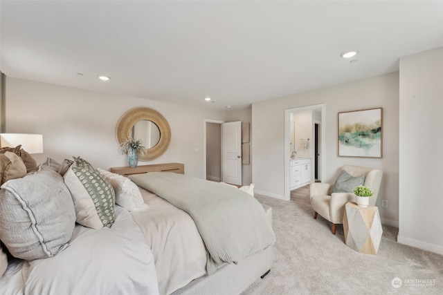 carpeted bedroom featuring ensuite bath