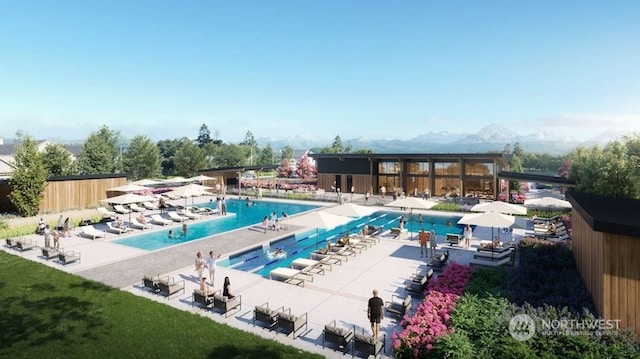 view of pool featuring a patio and a mountain view