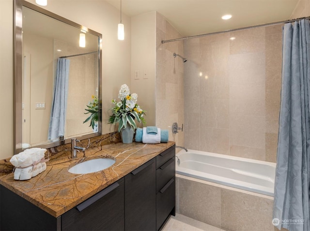 bathroom with vanity and shower / bathtub combination with curtain