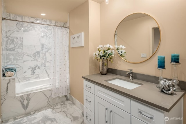 bathroom with shower / tub combo and vanity