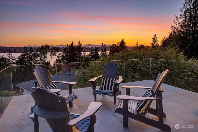 view of patio terrace at dusk