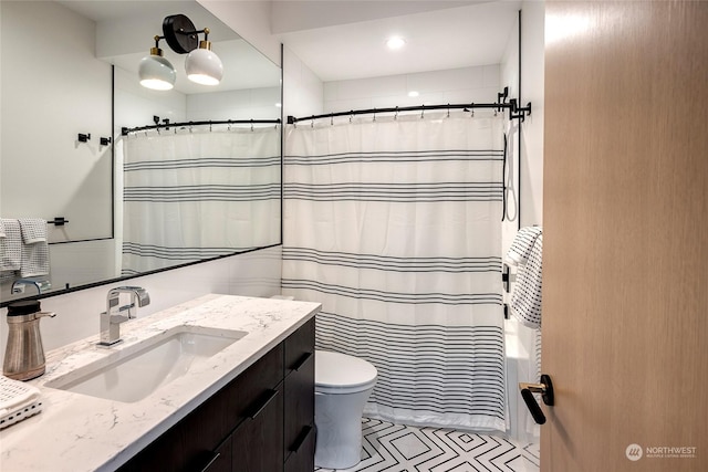 bathroom with toilet and vanity