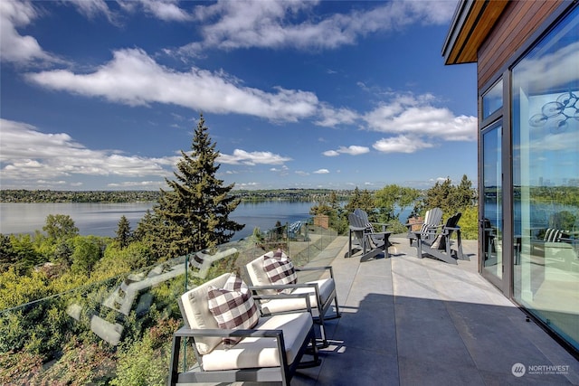 view of patio with a water view