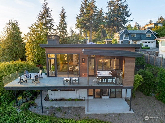 back of house with a patio area and outdoor lounge area