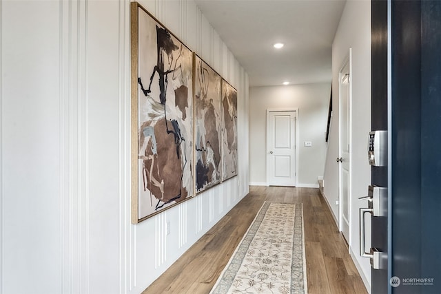 corridor featuring wood-type flooring