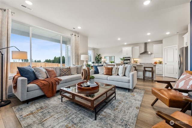 living room with light hardwood / wood-style floors