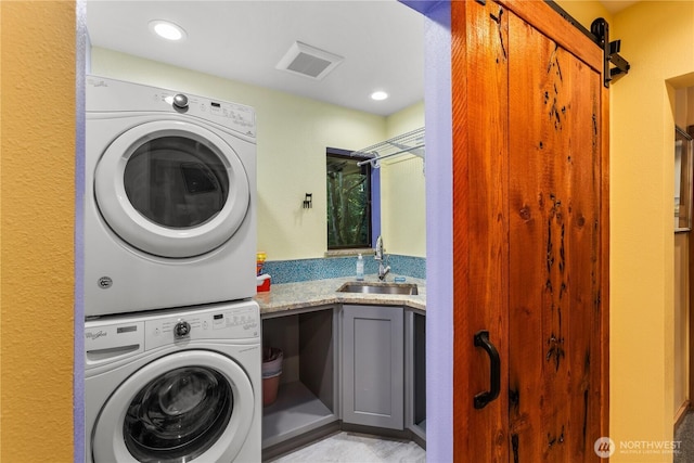 6520 E Mercer Way, Mercer Island, WA 98040 - washroom featuring stacked washing machine and dryer, cabinet space, and recessed lighting