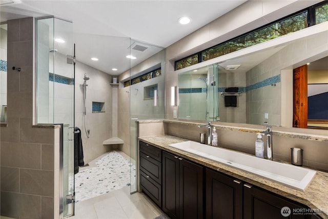 6520 E Mercer Way, Mercer Island, WA 98040 - full bath with tile walls, a shower stall, vanity, tile patterned flooring, and recessed lighting